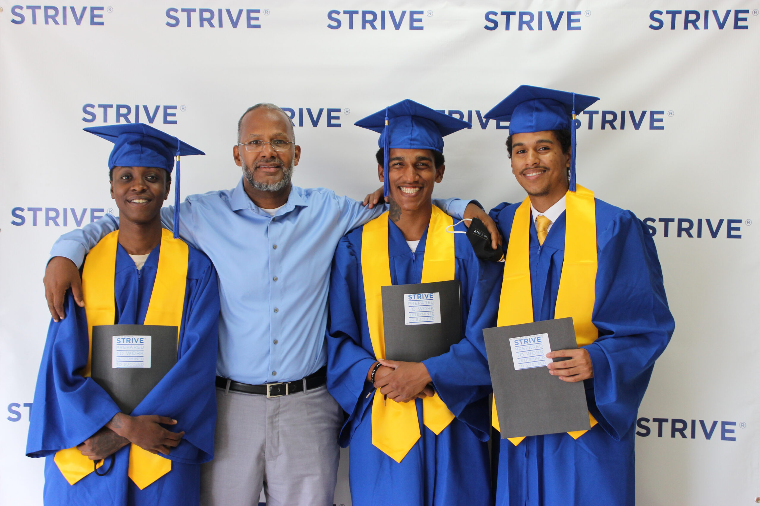 Manny Pacheco, Future Leaders Program Manager with STRIVE graduates, 2024.