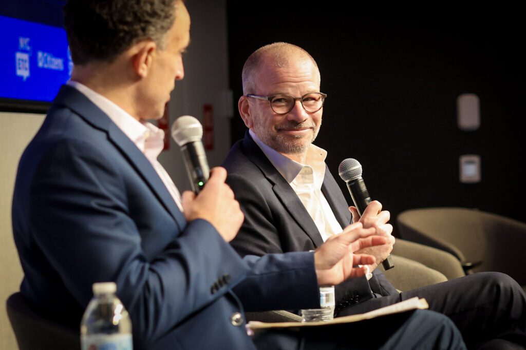 Andrew Kimball with Ben Max on the stage during the 2024 NYCETC Conference.
