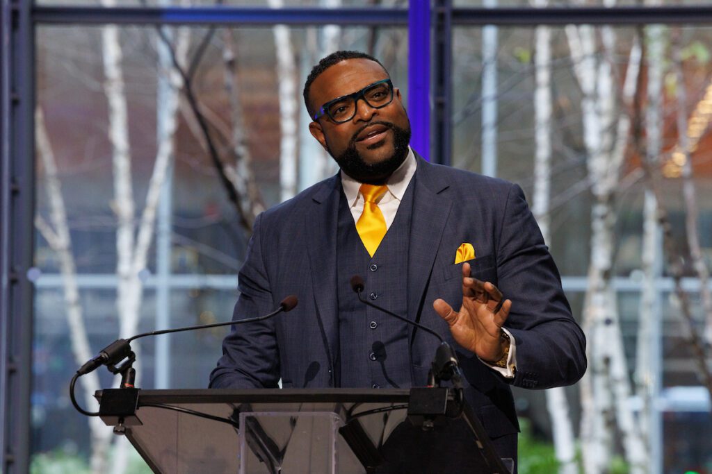 Randy Moore delivering the keynote on stage at the 2025 NYCETC Conference.