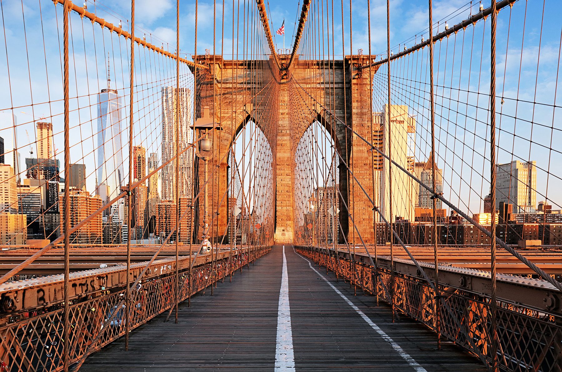 A photo of the Brooklyn Bridge pedestrian path without any people.