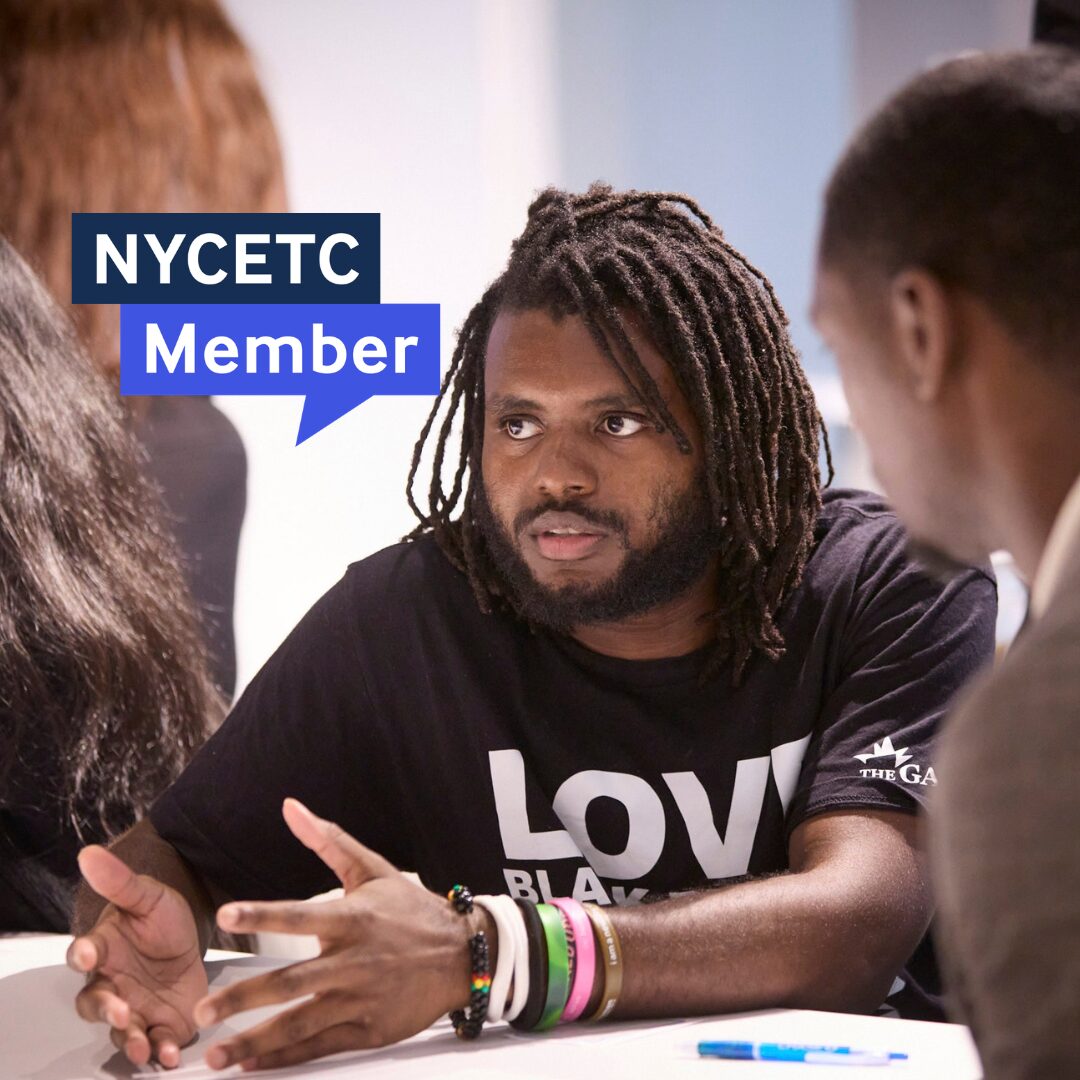 A workforce benchmarking network cohort member in discussion during a meeting.